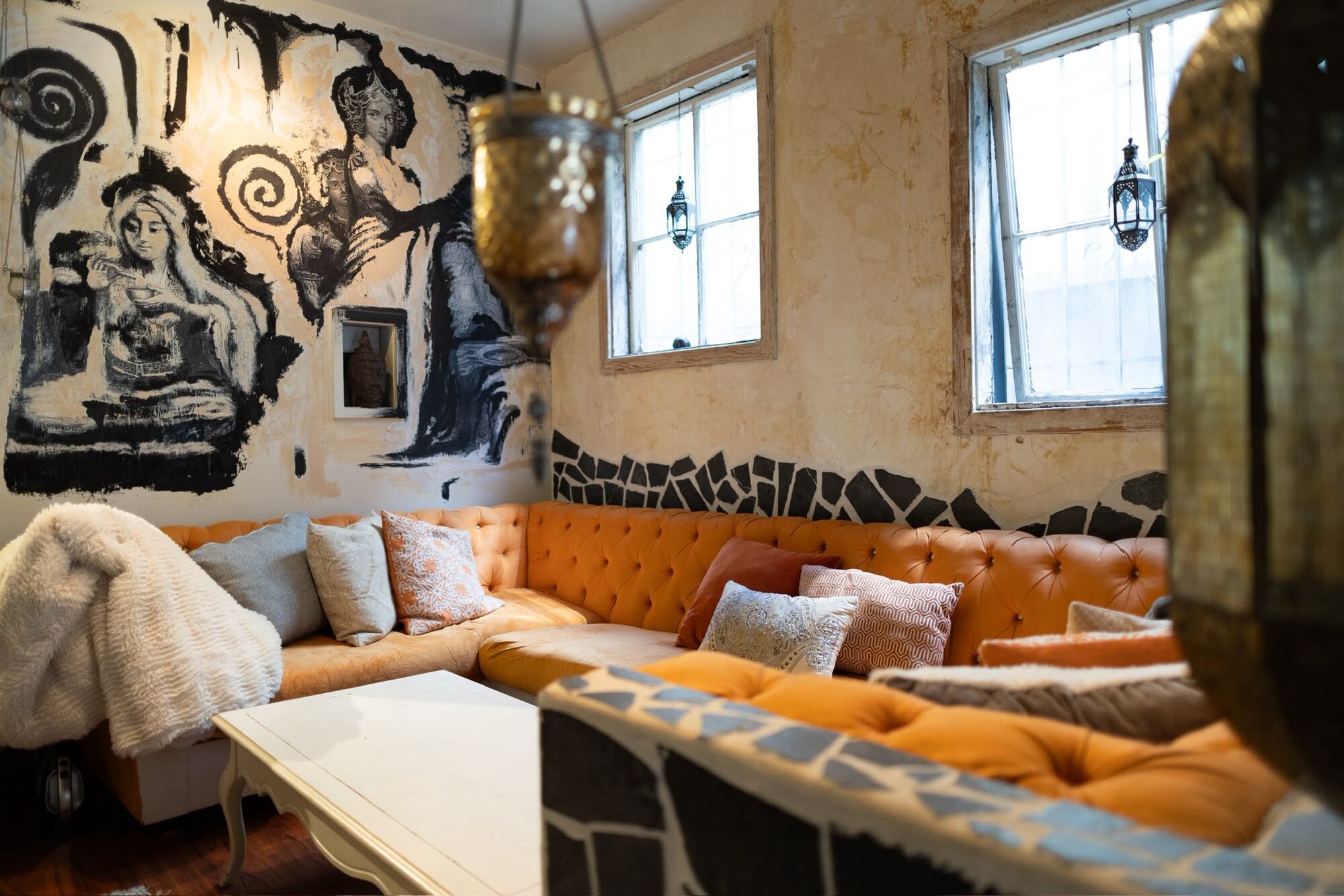 The lounge at Tantara with its mural and velvet sofa